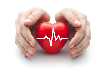 Red heart with pulse covered by man's hands. 