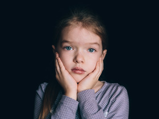 Portrait of a sad little girl