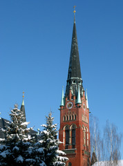 Obraz premium Altenburg / Germany: Wintry view to the steeple of the Church of the Brothers in the former residence city