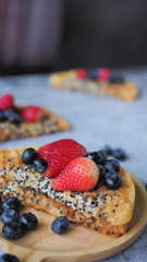 Waffles With Strawberry, Blue Berry in wooden plate.