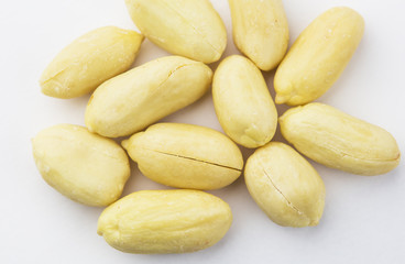 Peeled peanuts isolated on white background, close-up.