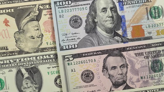 US dollar bills rotation, usd banknotes. 4K UHD video clip