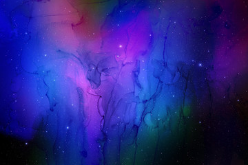 Colorful abstract space background on watercolor paper. Marble ink nebula image. Hand painted cosmos and stars.