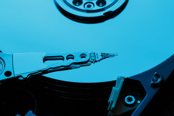 Disassembled hard drive from the computer, hdd with mirror effect. Opened hard drive from the...
