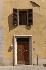 close-up wooden door ,wooden door with address lable,traditional tuscany Italy,europe style