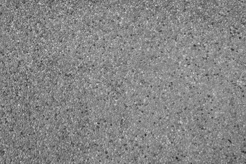 the black and white background from the old cement wall topping with washed sand