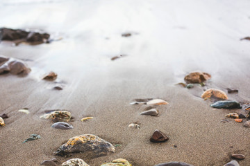 Fototapeta na wymiar Colorful pebble on the sea beach
