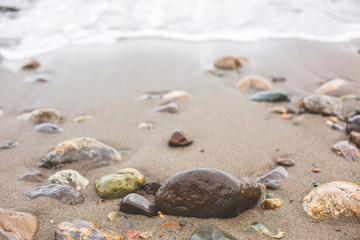 Fototapeta na wymiar Colorful pebble on the sea beach