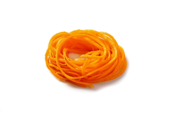 pumpkin vegetable noodles. spiralized butternut squash. isolated on white background.