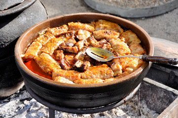 Hot, ready to serve traditional cabbage rolls with bay leaf in clay pot .