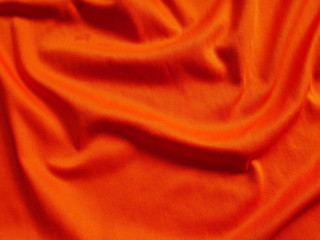 orange silk cloth background,cotton fabric texture,orange sportswear clothing