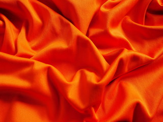 orange sportswear cloth texture,silk fabric background,orange satin clothing,orange background