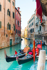 VENICE, ITALY- December 21, 2017 : Tourists on water street with Gondola in Venice,ITALY © ilolab