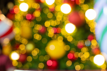 Obraz premium Abstract colorful lights blur and bokeh of Christmas Tree yellow, red, blue, green, gold Chrismas, New Year Vintage style.