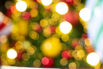 Obraz premium Abstract colorful lights blur and bokeh of Christmas Tree yellow, red, blue, green, gold Chrismas, New Year Vintage style.