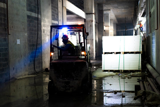 forklift in the construction site or factory. this site is in underground (Low light and very soft focus)