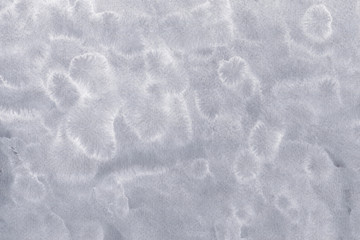 Silver with gray ink and watercolor textures on white paper background. Paint leaks and ombre effects. Hand painted abstract image.