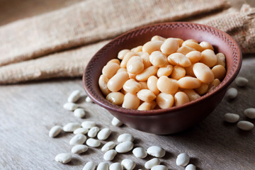 Boiled white kidney beans in a rustic bowl