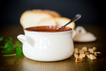 vegetable soup with beans and meatballs in a ceramic bowl