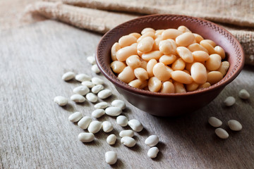 Boiled white kidney beans in a rustic bowl