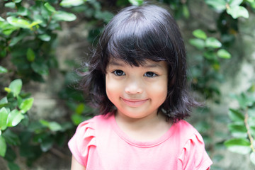 Happy Asian cute girl or kid smiling with happiness. face expression concept.