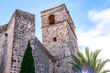 Fototapeta na wymiar The bell tower of Saint Bartholomew church in the old town of Xabia, also known as Javea, in Spain.
