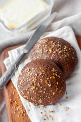 Homemade rye buns with linseeds, sesame and white poppy seeds