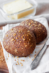 Homemade rye buns with linseeds, sesame and white poppy seeds
