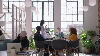 creative team meeting business people brainstorming mixed race woman leader using tablet computer showing creative ideas to colleagues collaborating in modern office presentation - Powered by Adobe