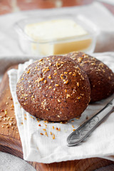 Homemade rye buns with linseeds, sesame and white poppy seeds