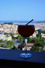 A glass of wine on the background of the city