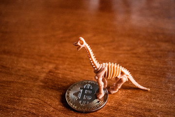 Dinosaur skeleton with bitcoin