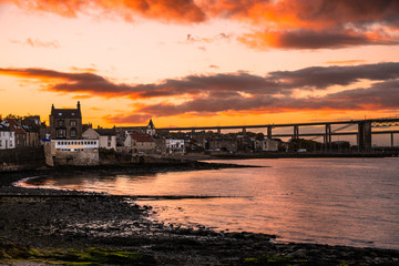 Fototapeta na wymiar Beautiful Orange Sunset over South Queensferry on the Shore of Firth of Forth, Scotland, UK