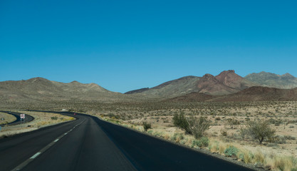 Arizona desert blacktop road in the mountains