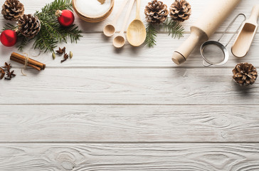 New Year frame from ingredient for homemade christmas cookies on a white wooden background, place for text.Flat lay.