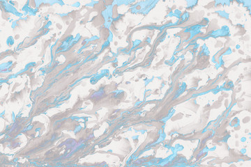 Colorful wet abstract paint leaks and splashes texture on white watercolor paper background. Natural organic shapes and design.