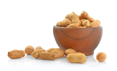 Peanut in wooden cups isolated on white background.