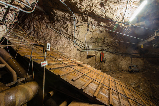 Underground gold iron ore mine shaft incline tunnel gallery passage human road