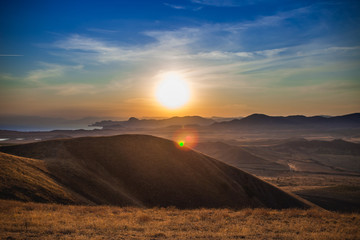 Fototapeta na wymiar Crimean mountains on the background of the setting sun
