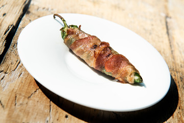 Grilled Pepper stuffed and covered with bacon