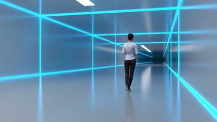 business woman walks along a futuristic corridor