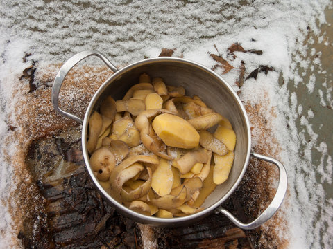 Casserole With Potato On The Snow, Outdoors Overhead Shot