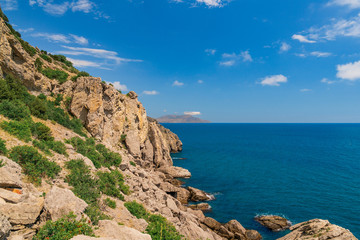 Fototapeta na wymiar Sea aerial view, Top view, amazing nature background.The color of the water and beautifully bright. Azure beach with rocky mountains and clear water of Crimea at sunny day