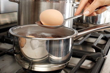 WOMAN BOILING EGGS