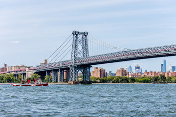 Fototapeta na wymiar The Williamsburg Bridge Crossing Over New York City's East River Into Manhattan