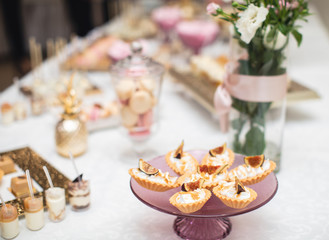 beautifully decorated table with sweet candy bar