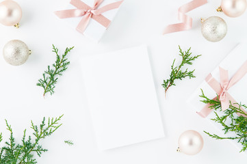 christmas decoration flatlay with pink ribion and presents on a white background with copyspace