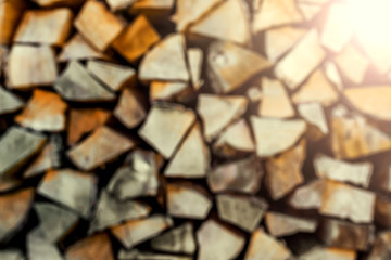 Abstract blurred stack of dry firewood as background