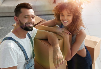 Portrait of a young family in a new apartment.