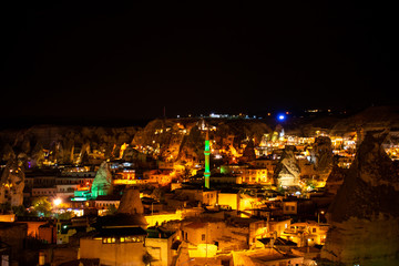 City at night illuminated by lights. Cappadocia, Goreme, Turkey. Aerial view